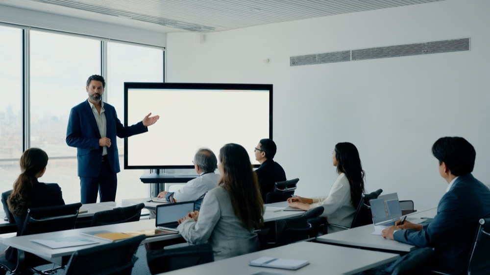 Real estate training session with a small group working through course material